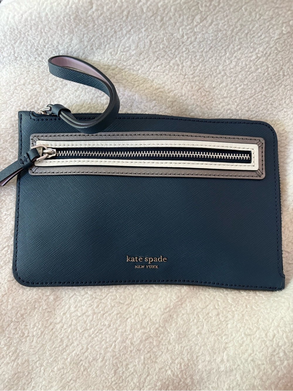 kate spade Navy Leather Wristlet with Contrast Zip Trim 6 in. X 4 in.